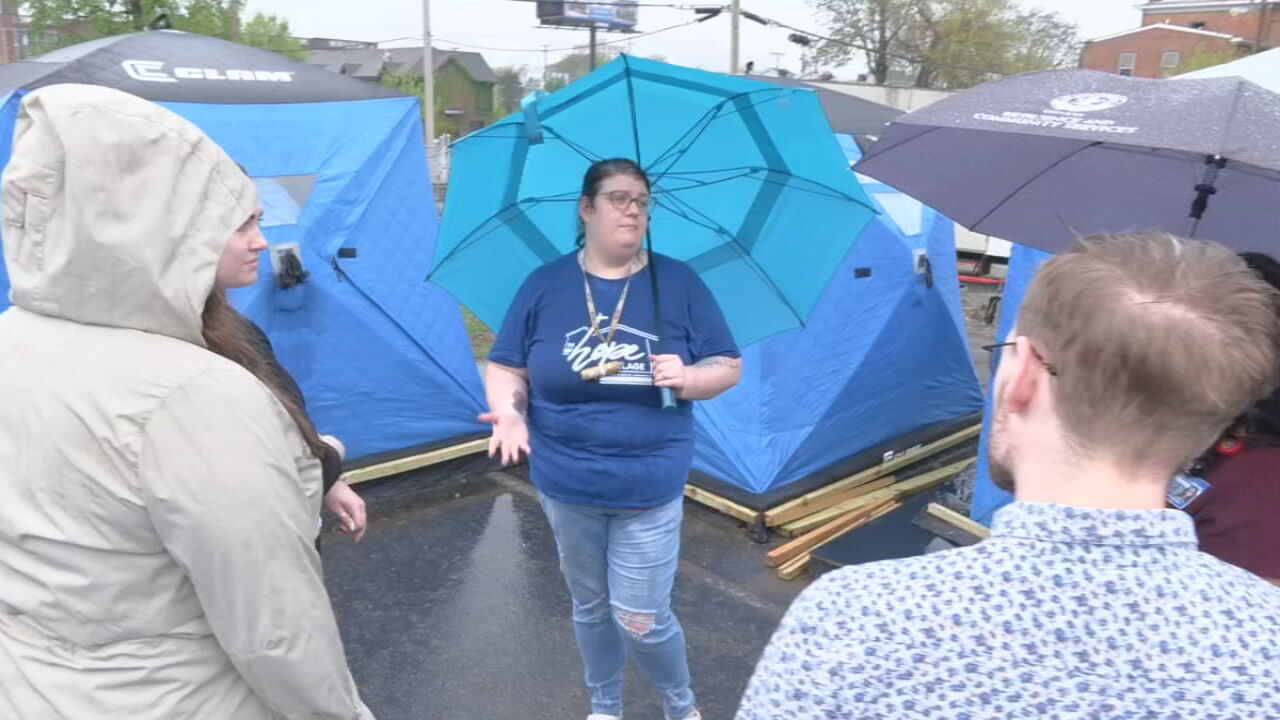 Sara Turney gives tours during open house for the Hope Village